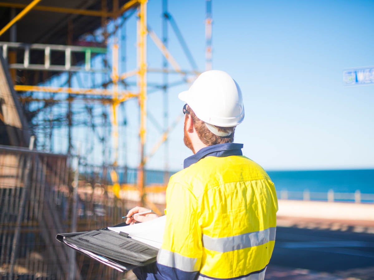 Construction worker with clipboard