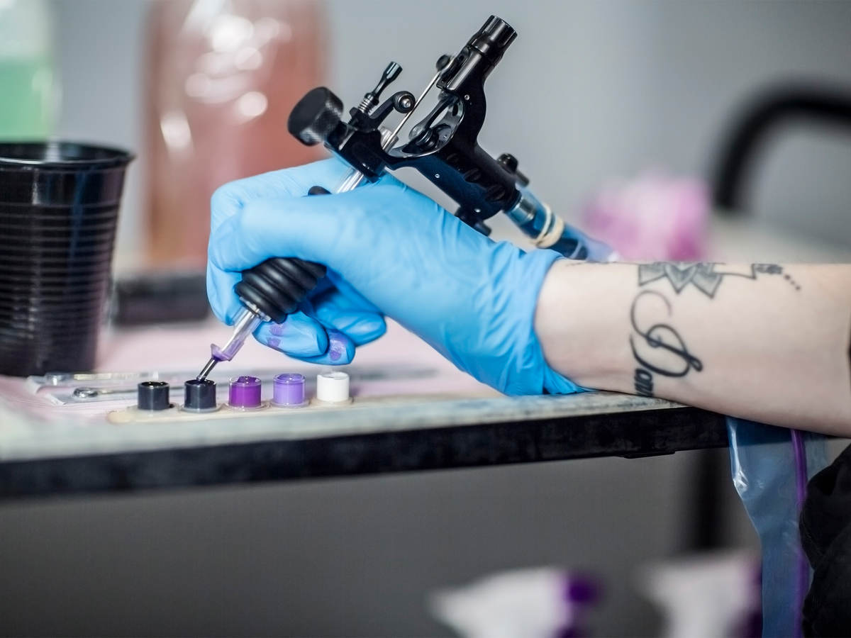 tattoo artist preparing in studio