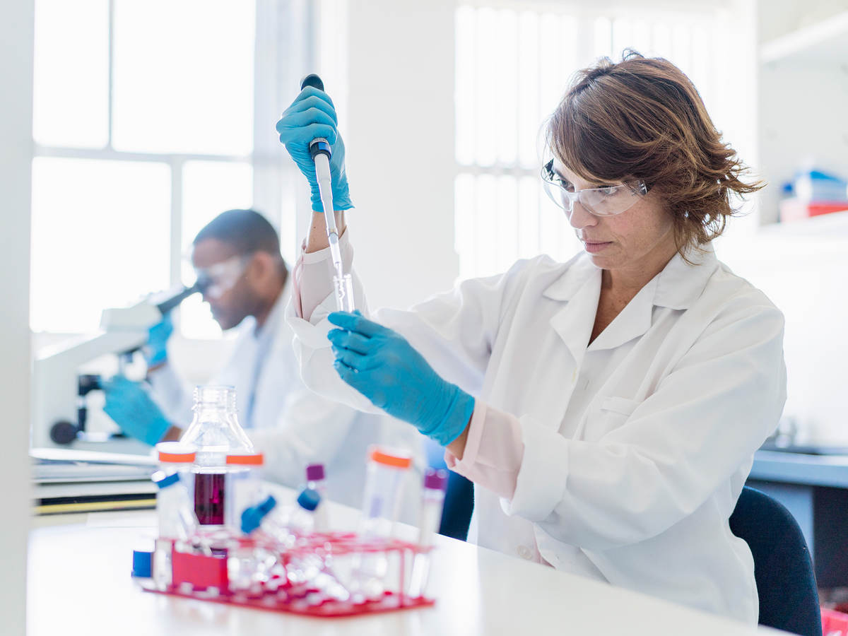 Concentrated chemist working on chemicals