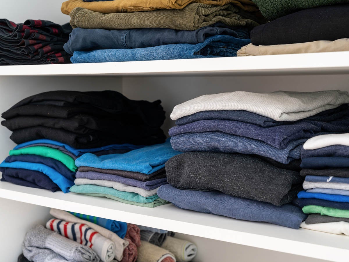 Shelf with folded clothing