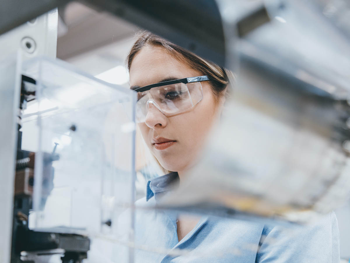 Female industrial worker working in manufacturing