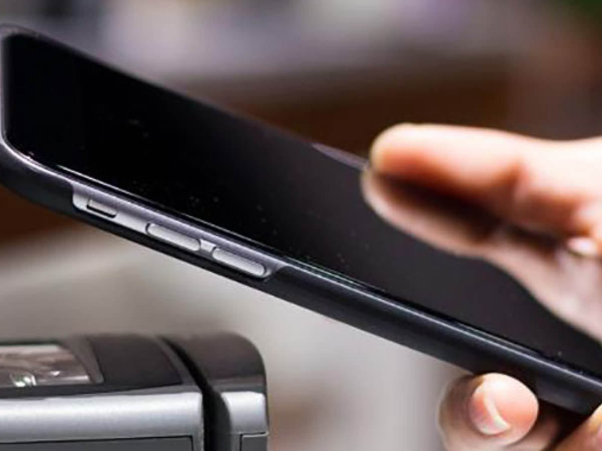 Mobile phone over a terminal being used for a contactless payment 