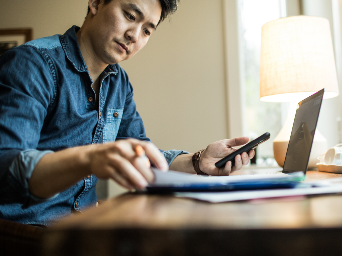 man looking at mobile device