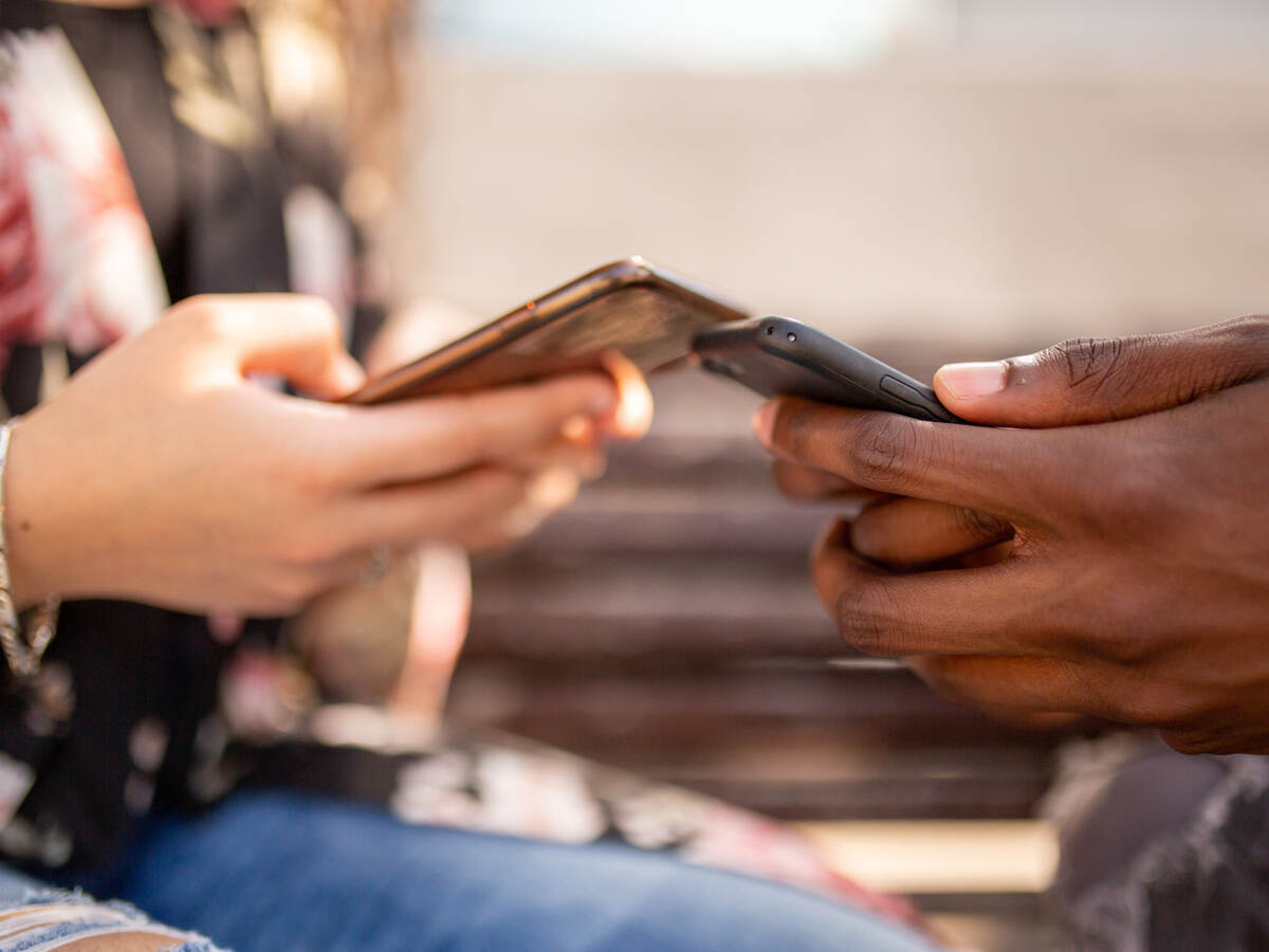 two people using mobile phone