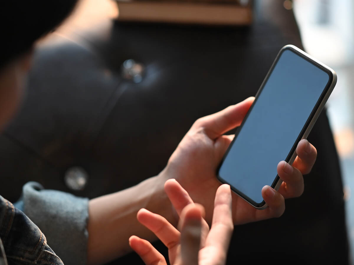 man looking at a mobile phone