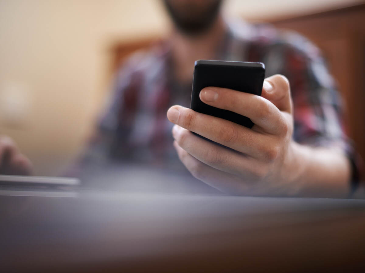 man holding a mobile phone