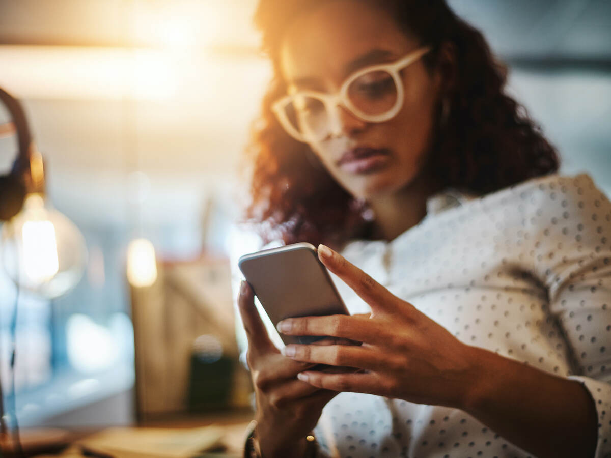 woman looking at a mobile phone