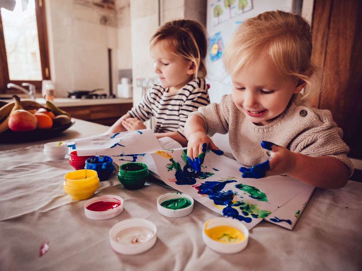 Children playing with finger paints