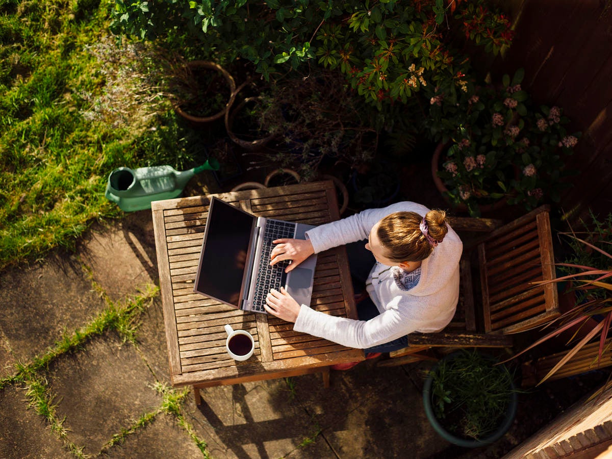 Woman working from home in her garden