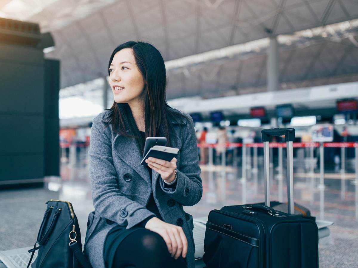 woman with luggage in the airport