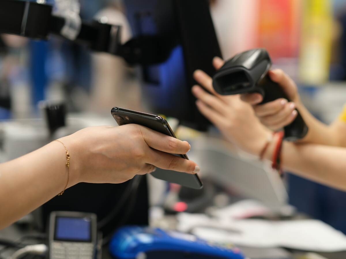 a mobile phone scanned for payment in shop