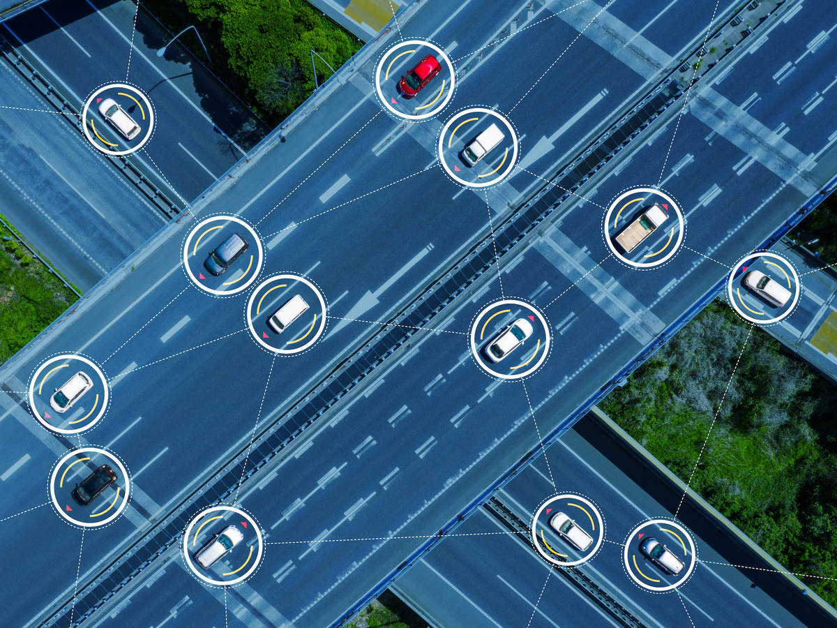 Overhead view of virtually connected cars driving on a highway