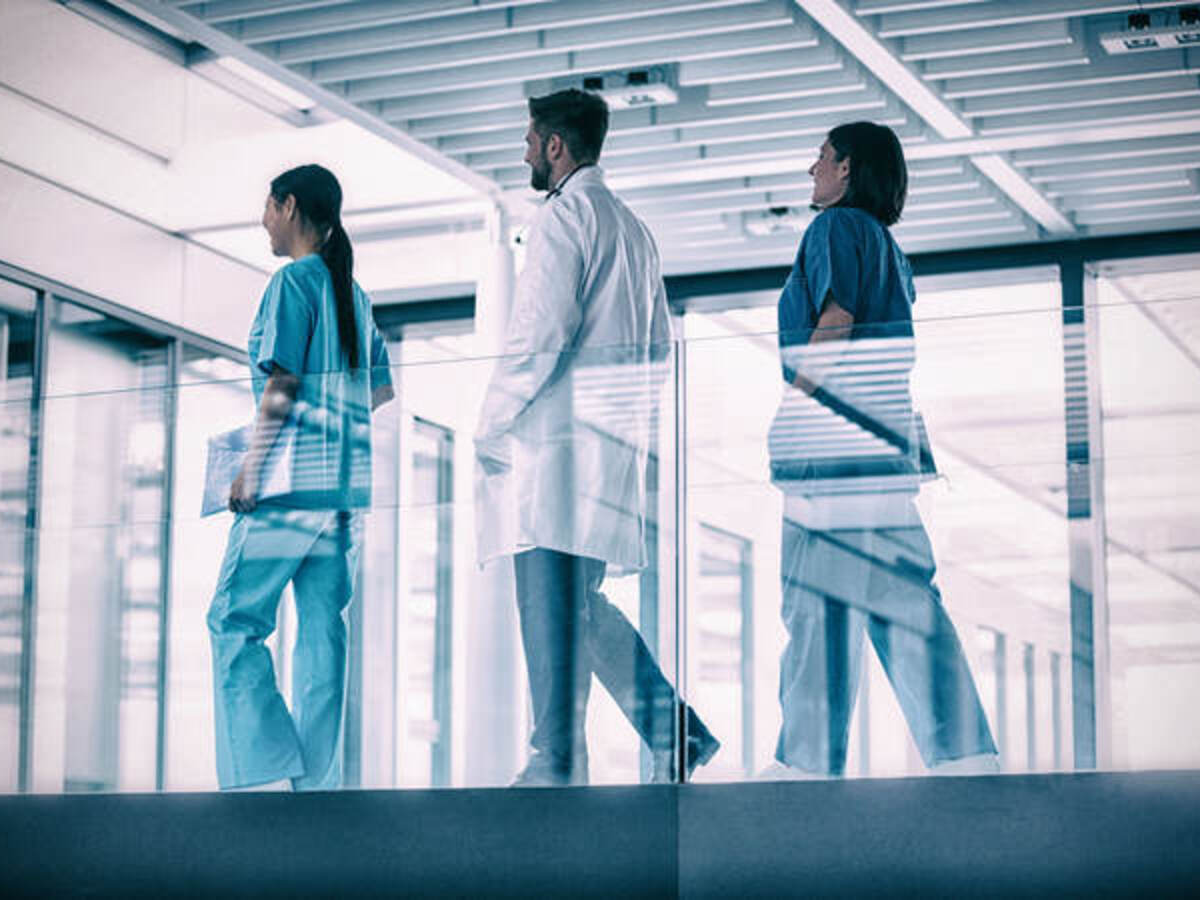 Doctor and nurses walking