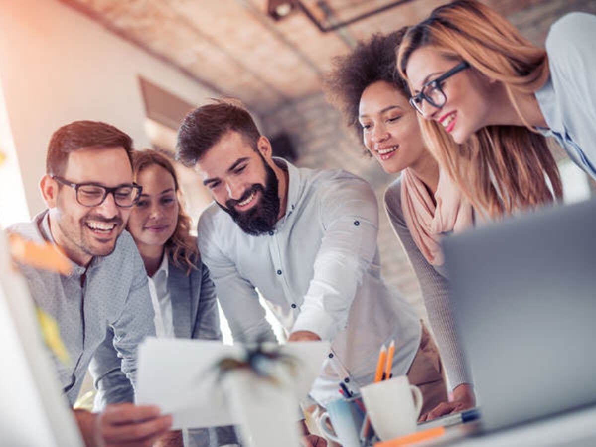 People reviewing a project, smiling 