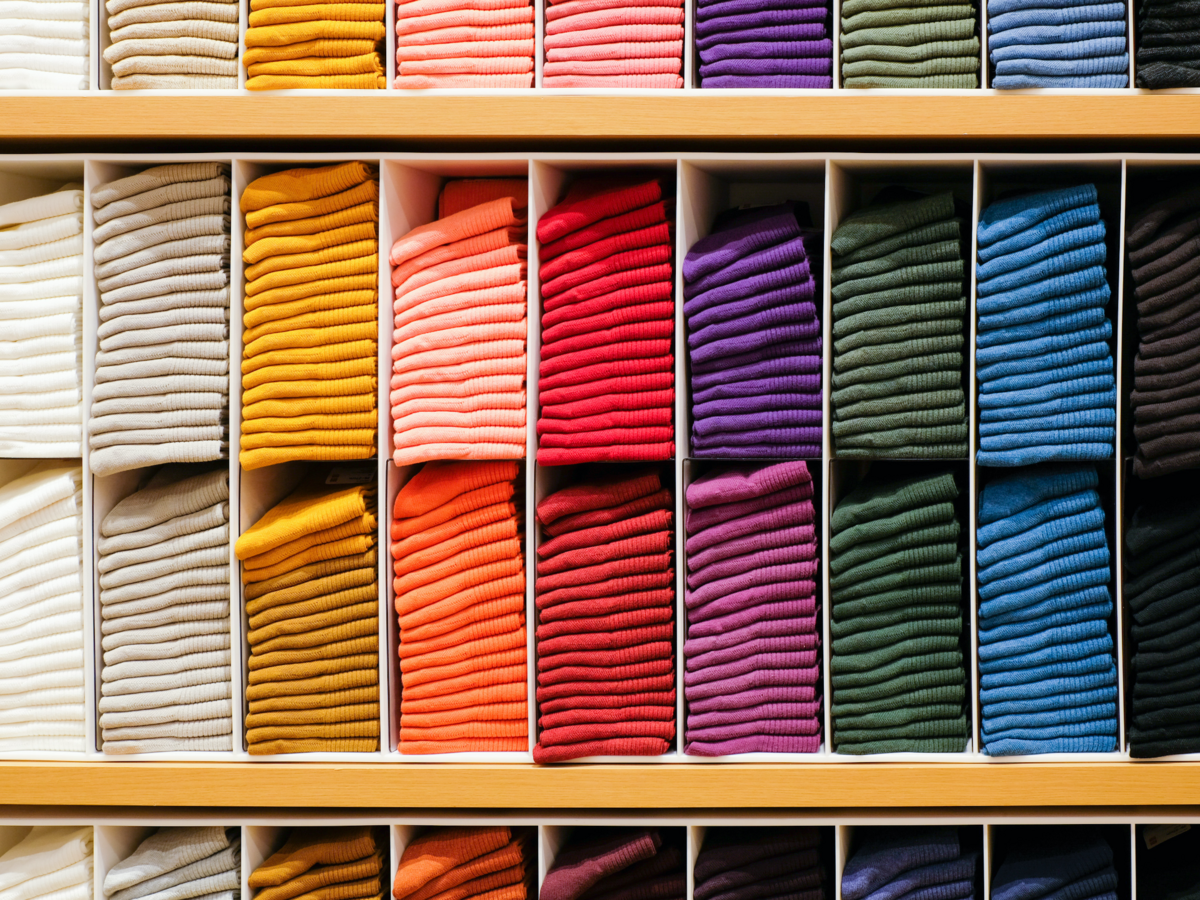 Colorful clothes on a retail shelf