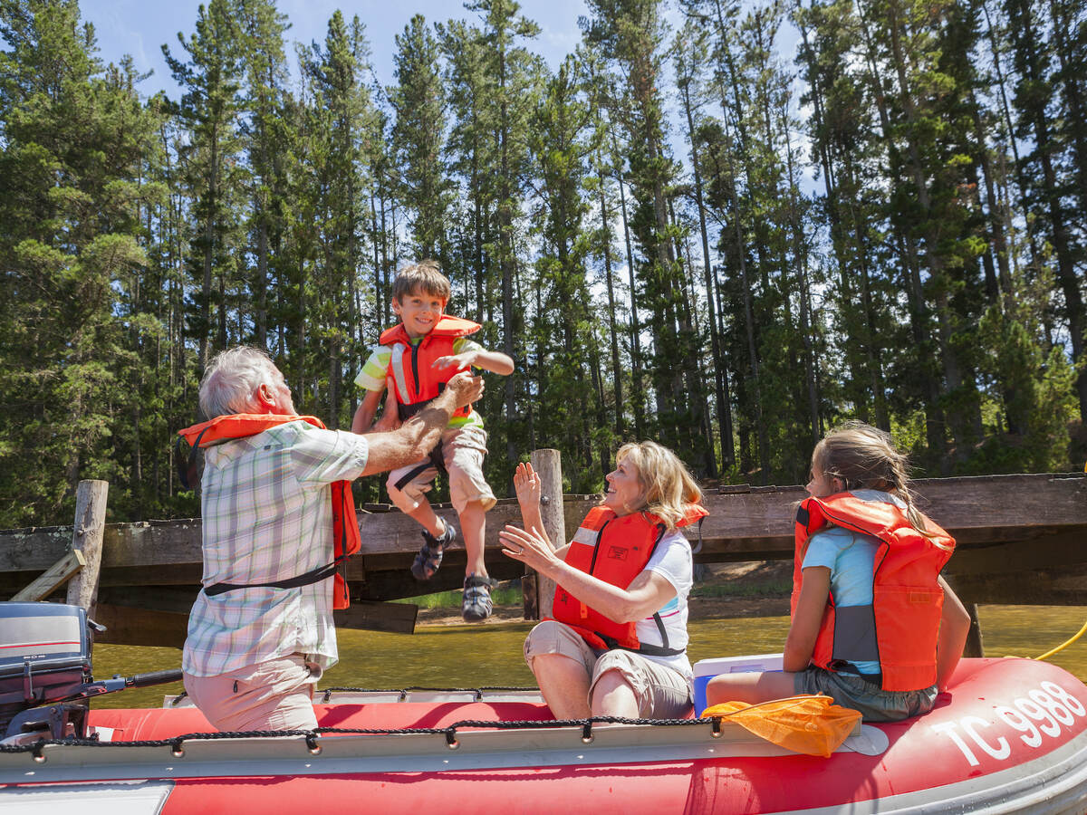 A family going boating wearing life vests