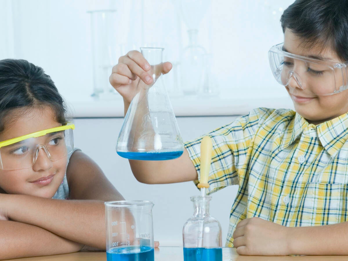 Two children learning science 