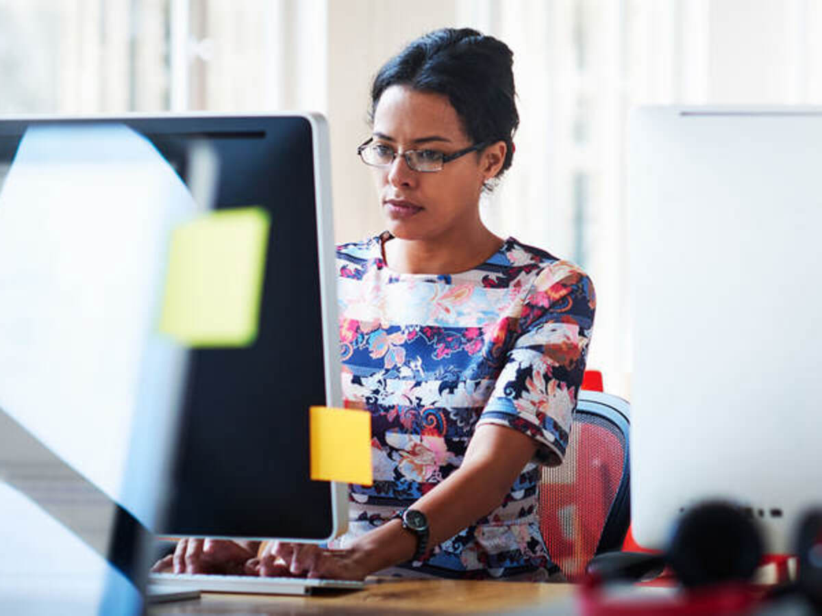 Woman reading news on a computer screen