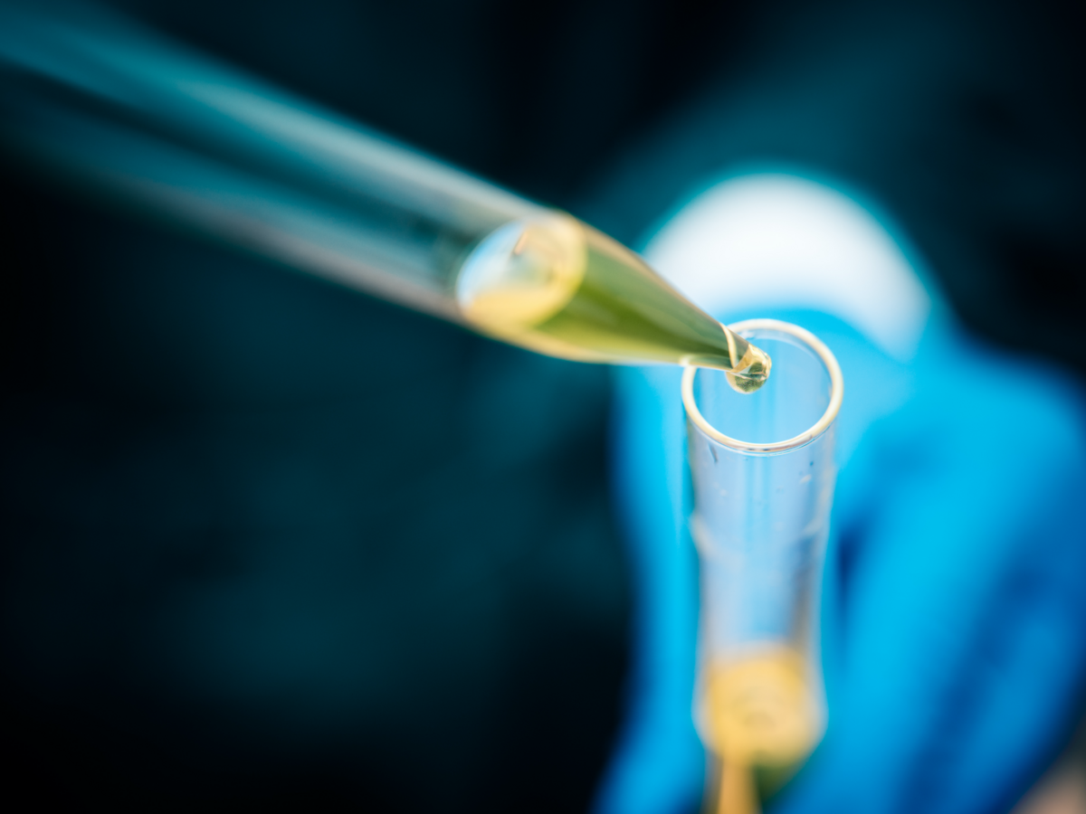 Chemical being added to a beaker