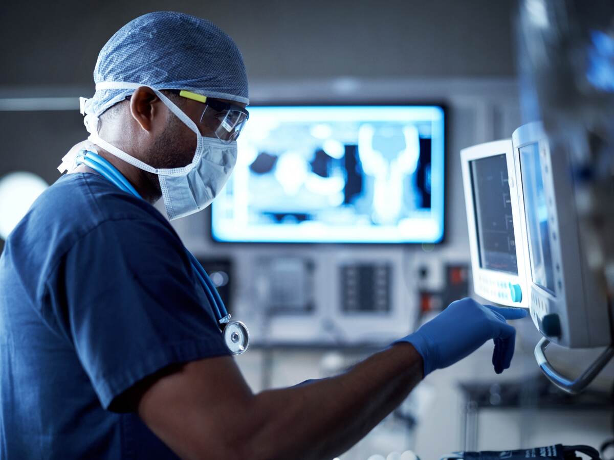 Surgeon looking at a monitor in an operating room