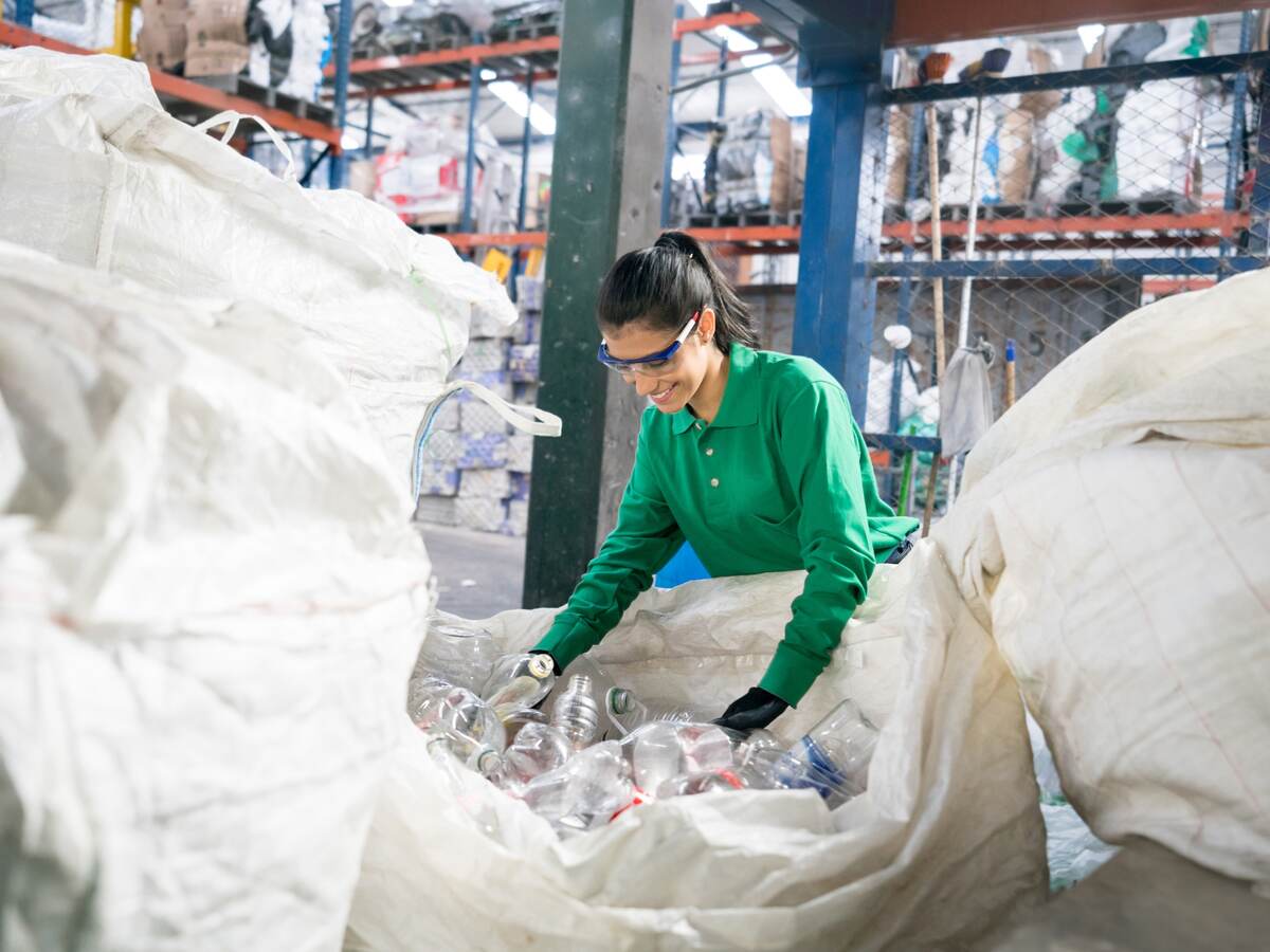 Woman working in recycling factory