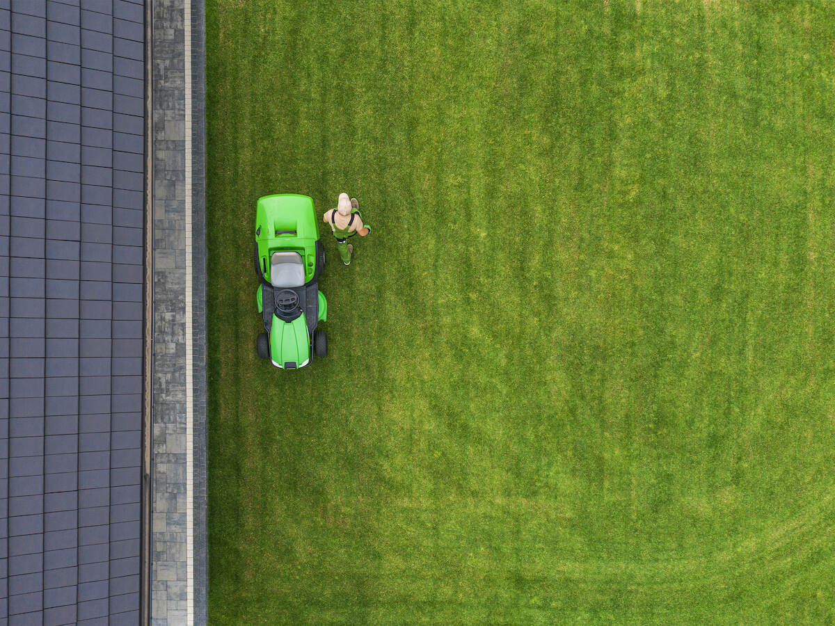 aerial view of a tractor cutting grass