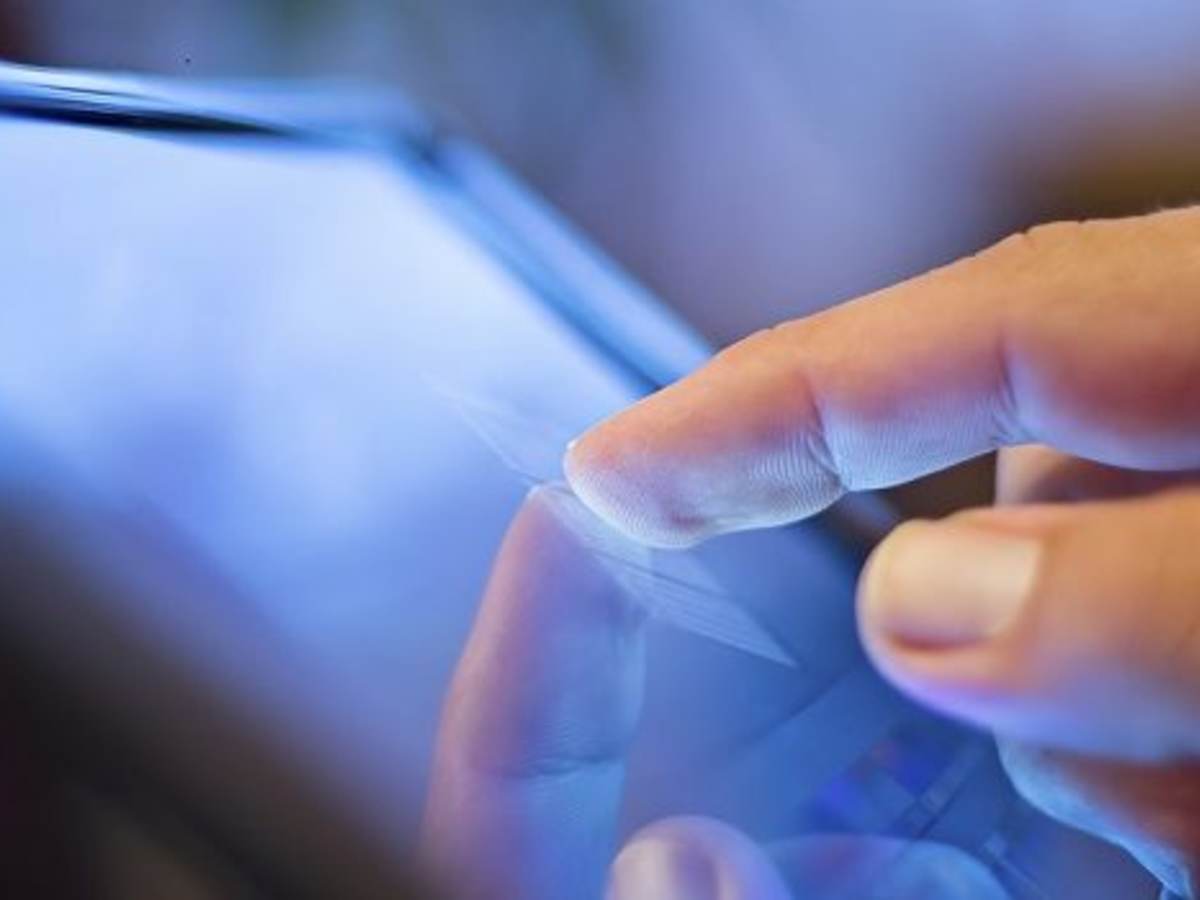 finger tapping a tablet
