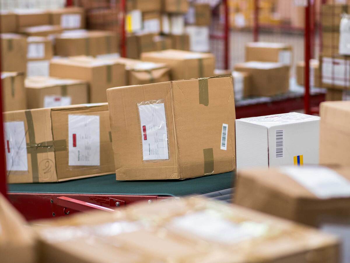 Cardboard boxes packages on conveyor belt 