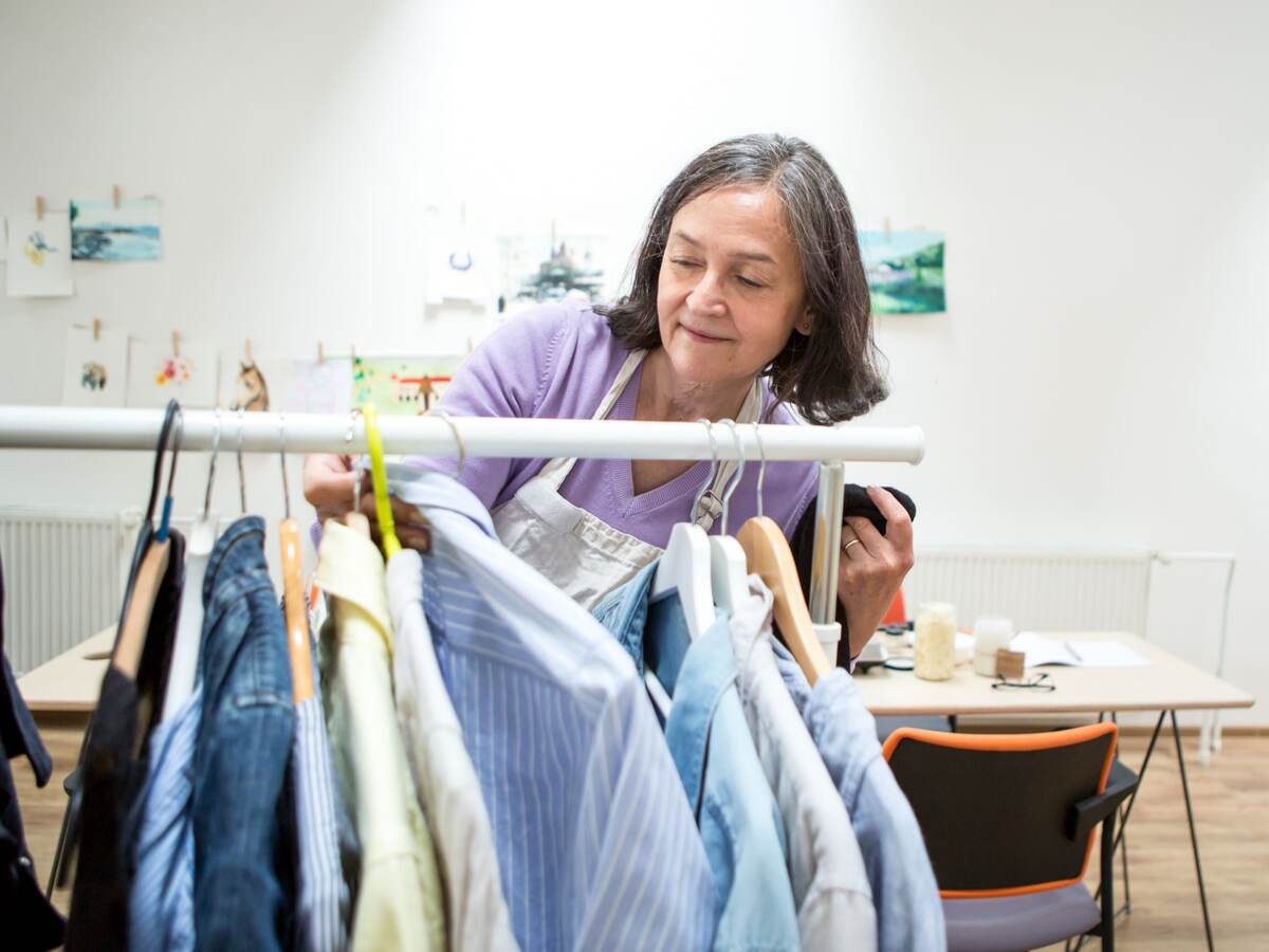 Woman checking the label of a shirt
