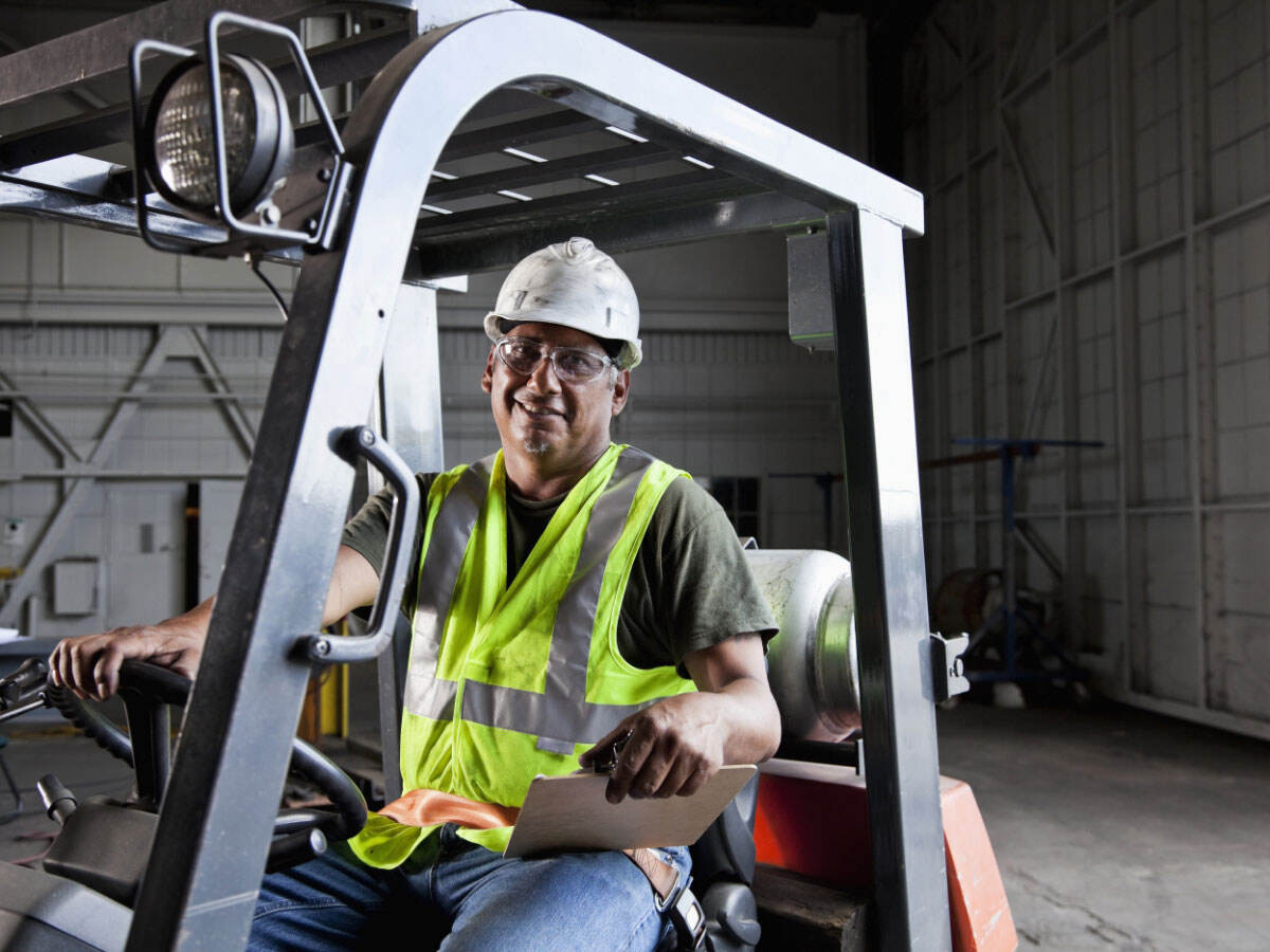 Smiling forklift driver