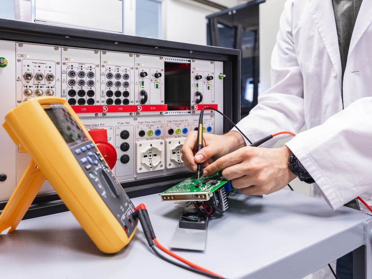 Engineer conducting electrical safety and performance tests.