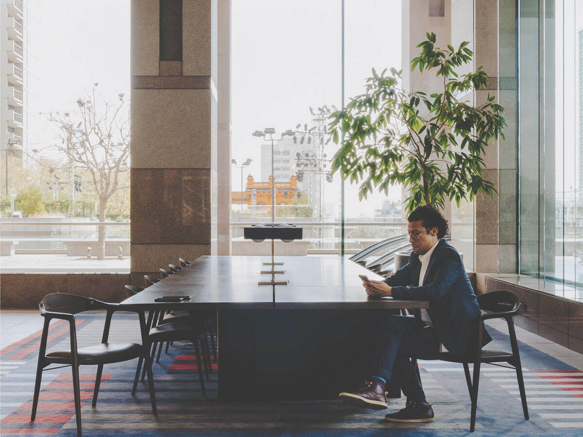 Person working at a long meeting table