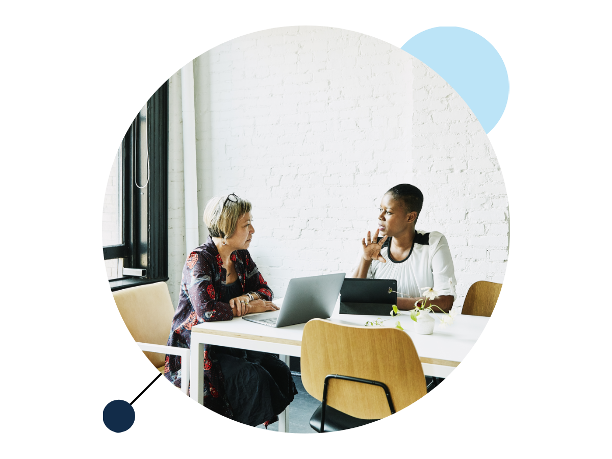 two people discussing in a meeting