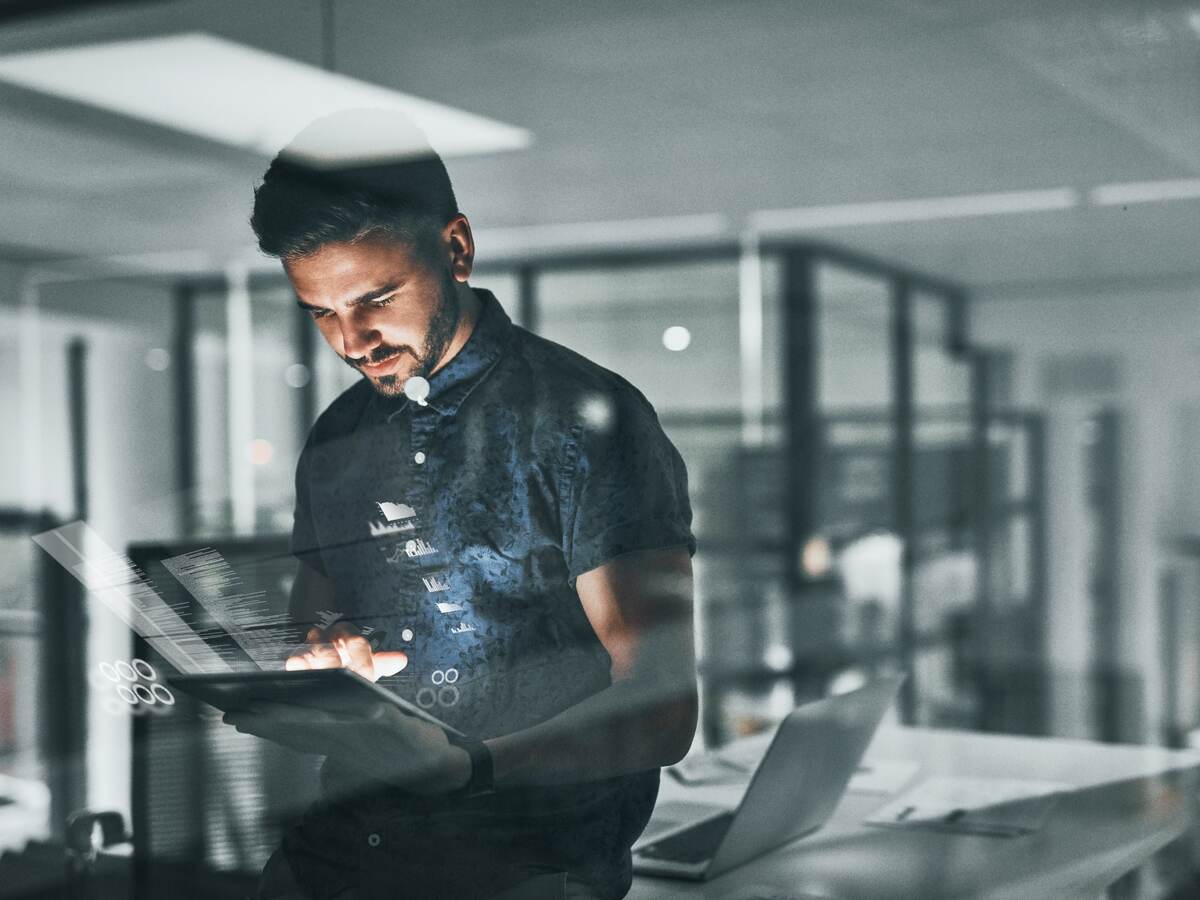 Man holding a tablet at office.