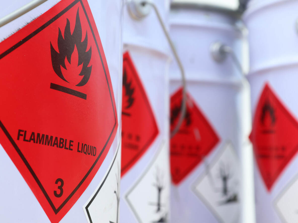White drums with red flammable liquid symbol on the side
