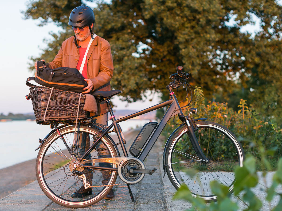 Person standing next to an e-bike