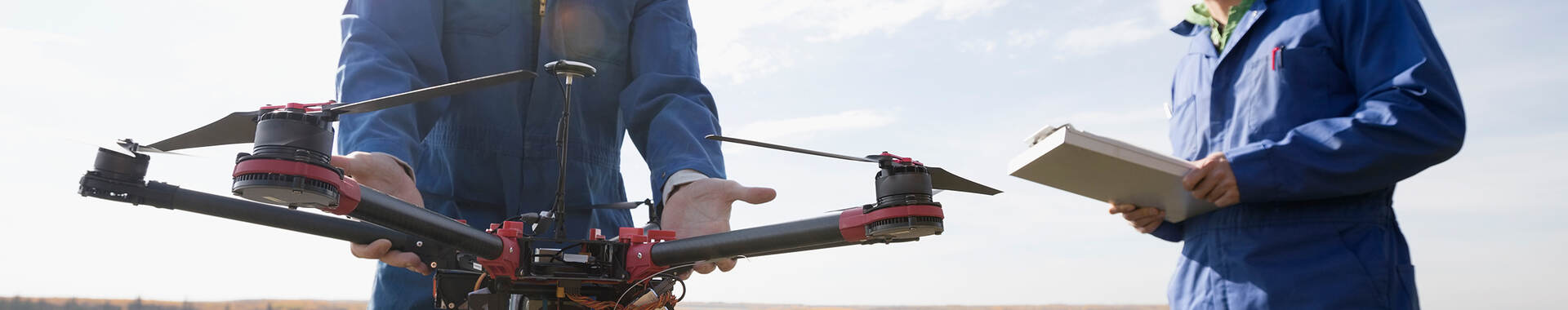 2 workers looking at field equipment
