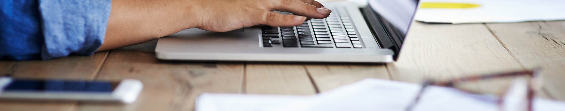 Person sitting at her desk receiving training
