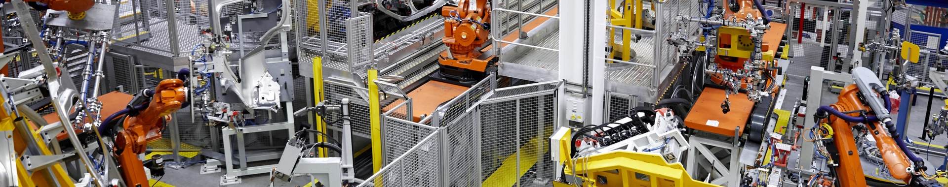 Robots putting cars together in a factory
