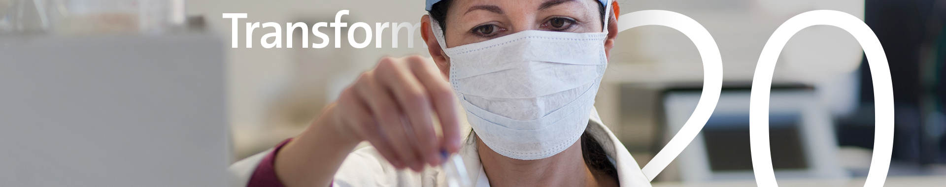 Transform 2020: Masked medical scientist working in a lab