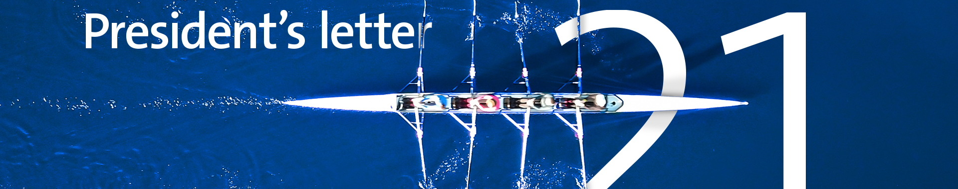arial view of 4 person rowing team on water with president's letter and 21 in writing