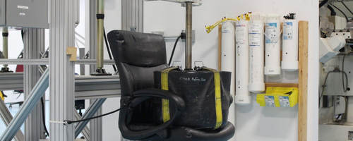 A weight sits on an office chair as part of testing