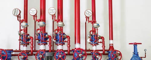 Red pumps and valves in a fire station. 