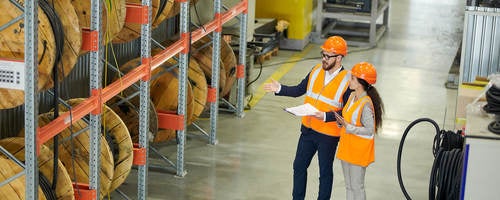 Workers auditing a warehouse