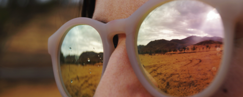 Woman with sunglasses looking at mountains