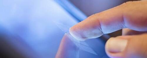 finger tapping a tablet
