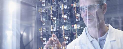 Scientist inspecting test.