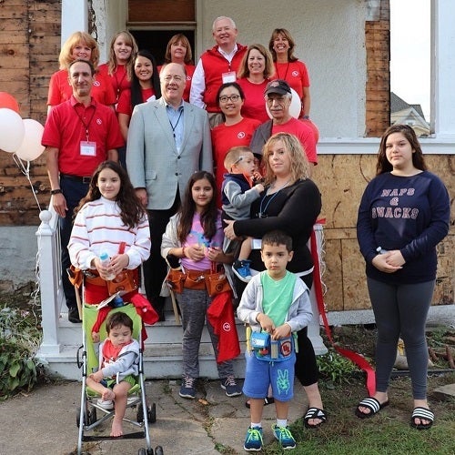 photo of Mejia family in front of house