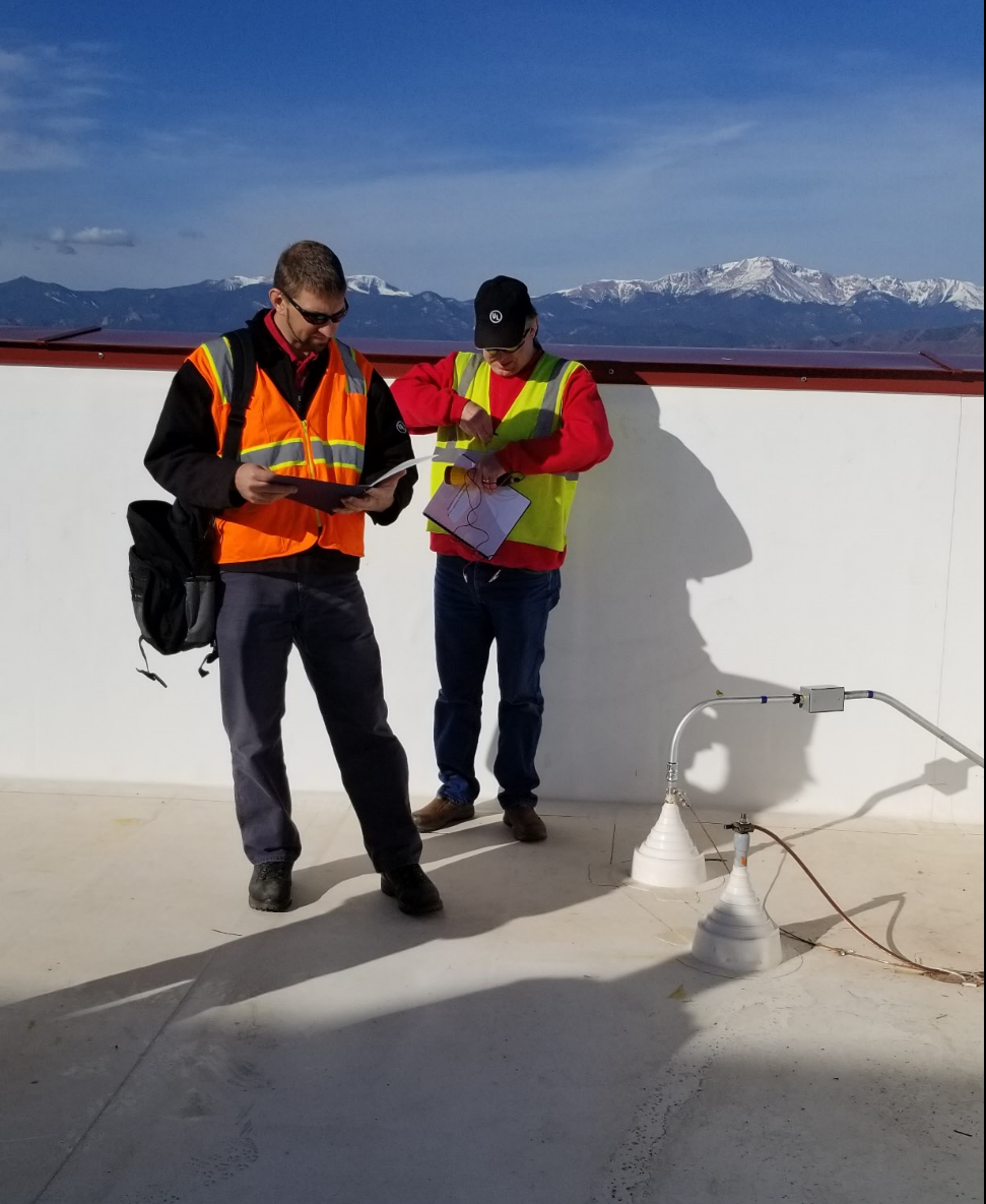 UL’s technical experts evaluate lightning protection system (LPS) components on a hospital roof.