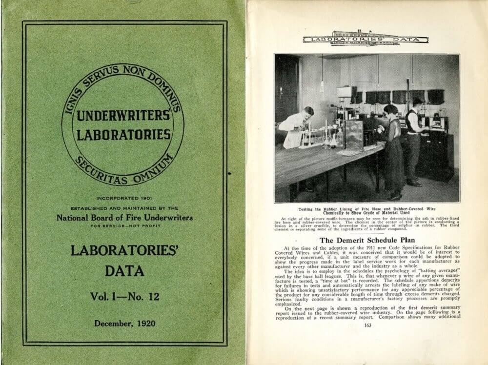 Photo of the book from where the chemist in the center was found. The book has a green cover with black lettering. Underwriters Laboratories is printed in the top center of the cover with the words ignis servus non dominus and securitas ignum around it. 